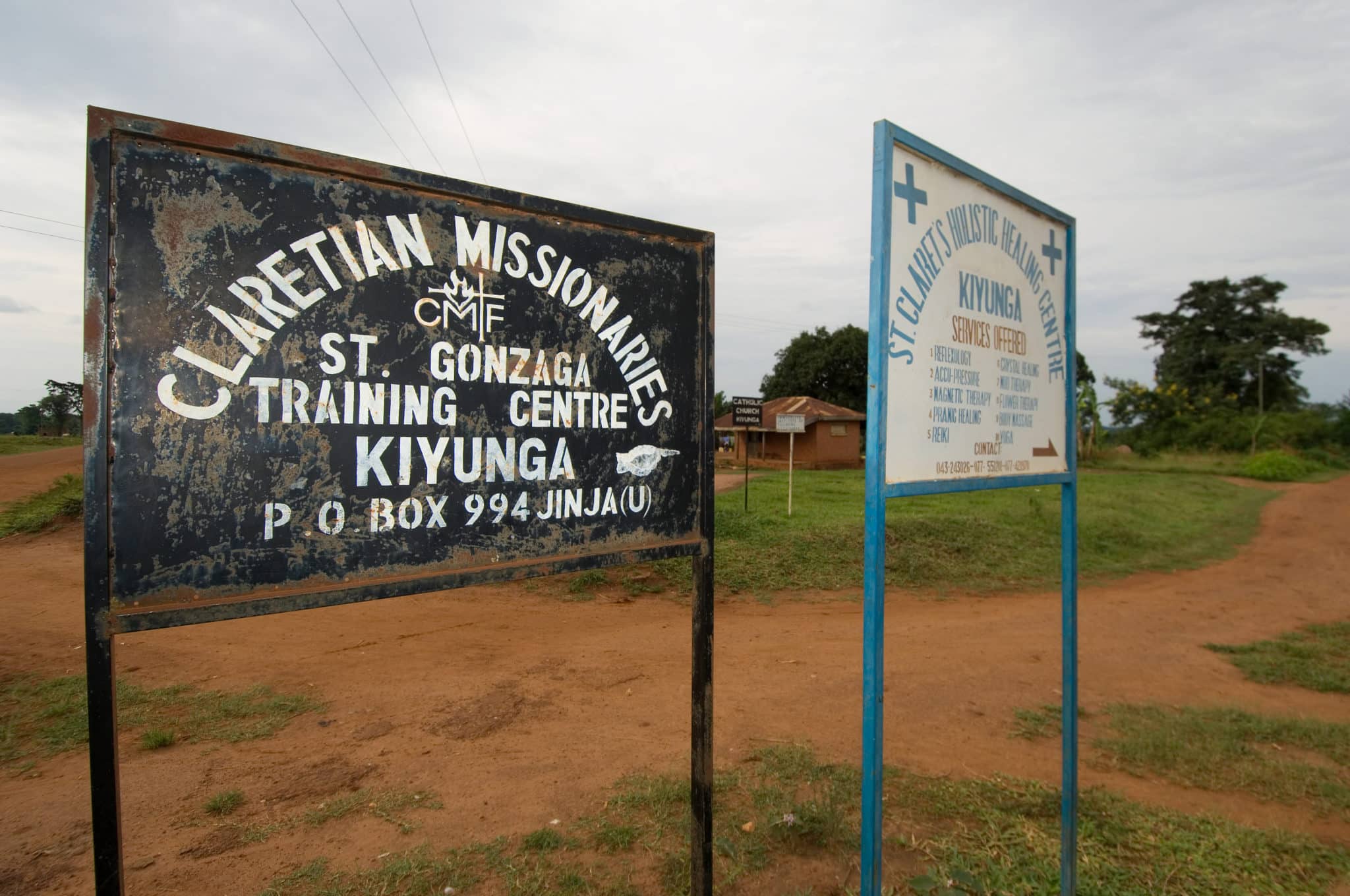 Signs on the main road direct parishioners to the Kiyunga parish and the other services available through the site. Established in Kiyunga in 1997, the Claretians now have tow full time priests in Kiyunga, in eastern Uganda, and provide a range of services through the parish, including a training center for lay church leaders and a holistic healing center.